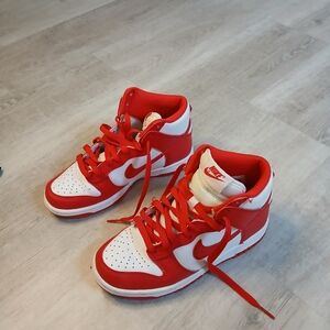 LIKE NEW Nike Dunk High tops in red. size 36 EU, fits a size women's 6.